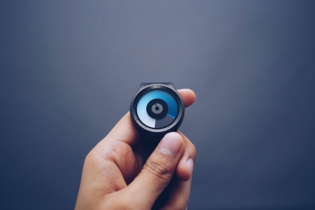 An image of someone holding a smart watch